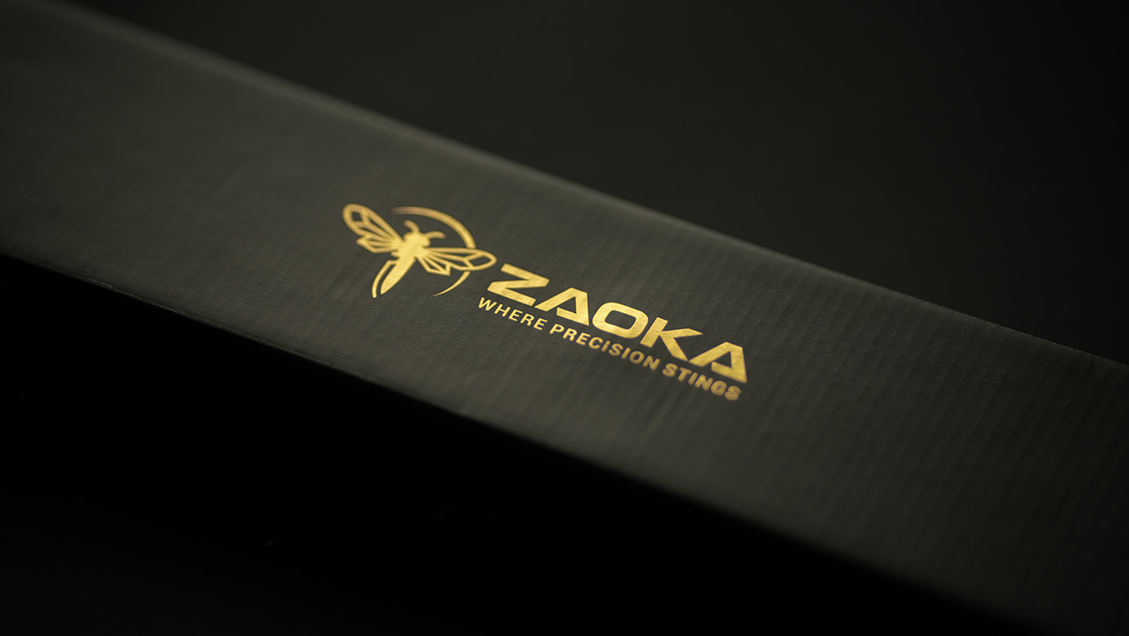 Close-up of the gold foil Zaoka logo