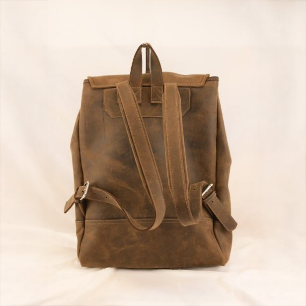 Brown leather backpack made from natural calfskin